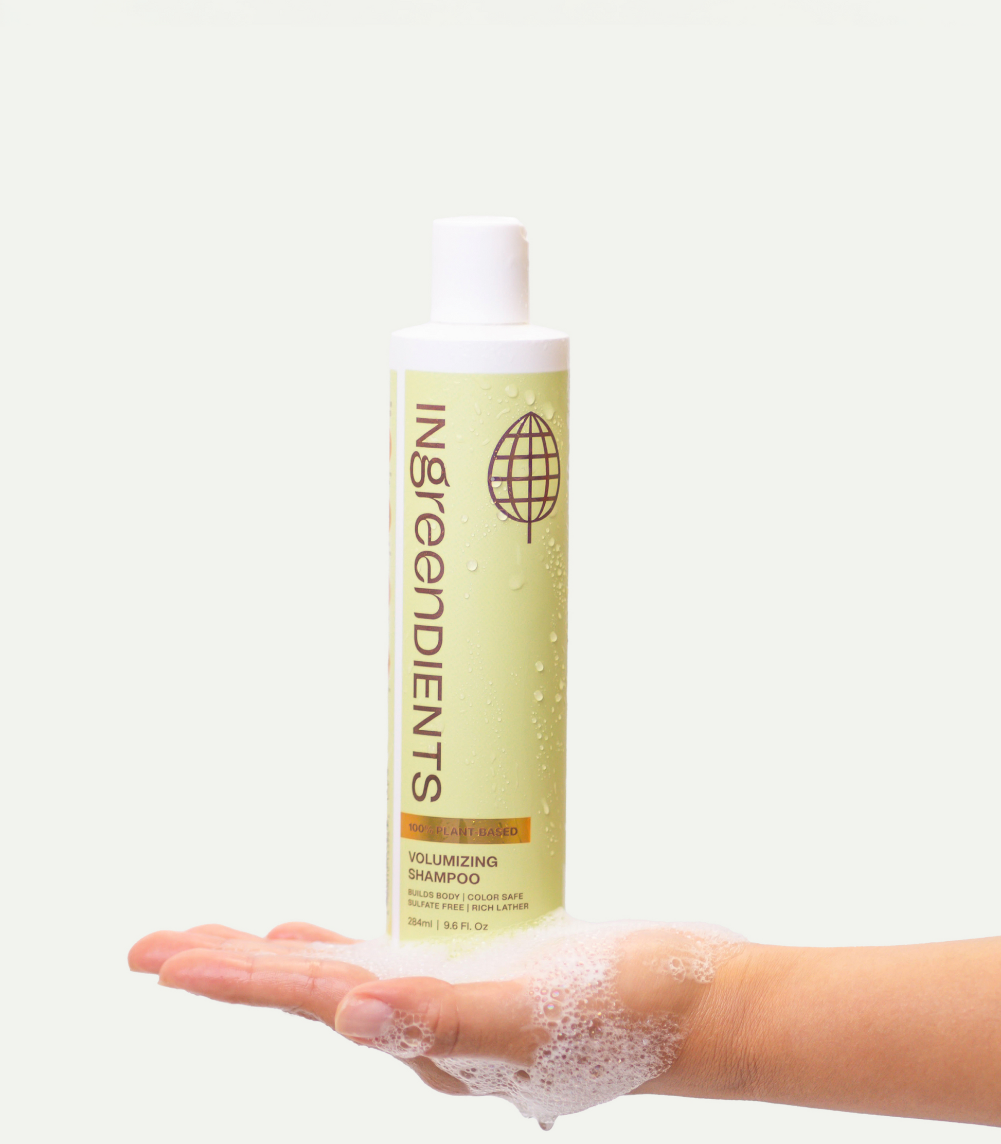 Icons or graphic representing key features of the Volumizing Shampoo, like clean ingredients